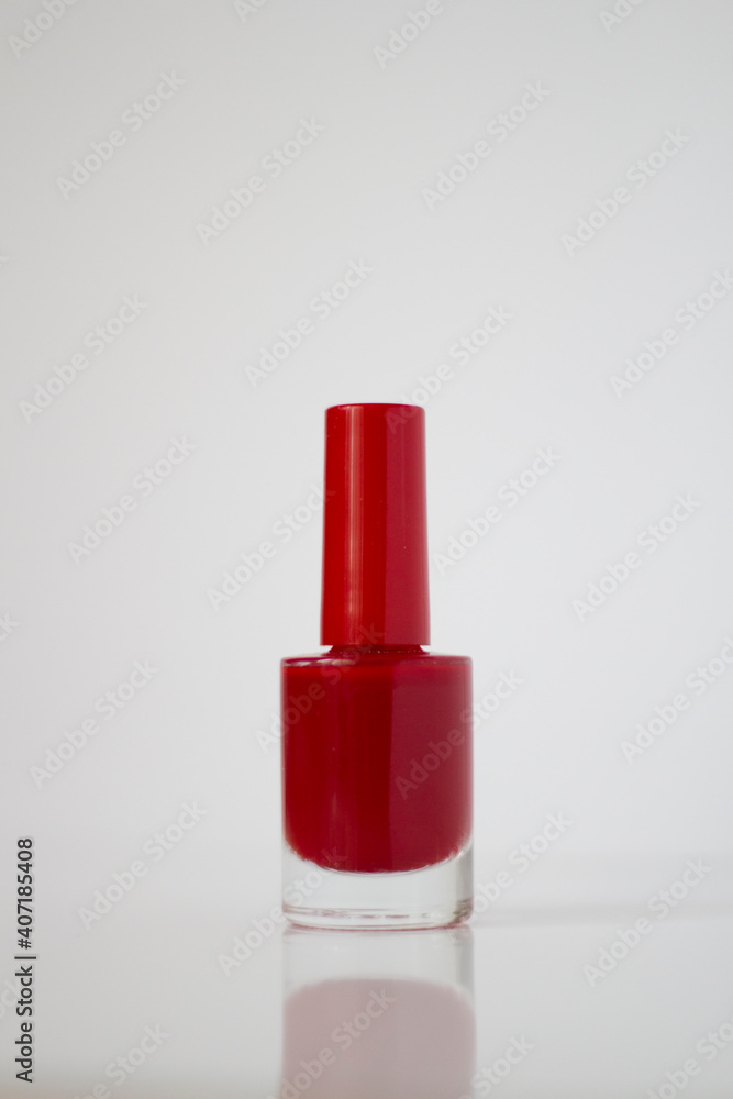 Red nail polish on a white background. Manicure. Red nail polish on a white background. Manicure.