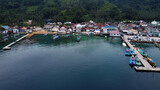 Pier with at Lampung Sea Pahawang Beach, located near the Sumatera city aerial drone. Resort Pahawang With a clouds on the Sky in a day. 
