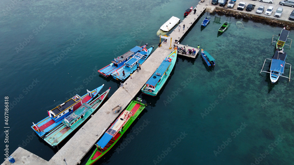 Aerial view of top down picture of colorful wooden boats. Boats at the pier. 