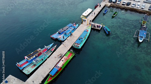 Aerial view of top down picture of colorful wooden boats. Boats at the pier. 