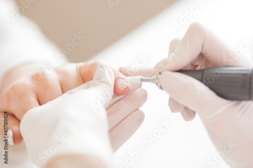 manicure in beauty salon. woman doing manicure