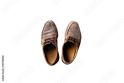 Old brown leather shoes isolated on white background