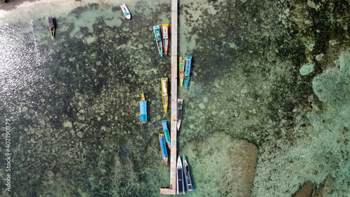 Aerial view of top down picture of colorful wooden boats. Boats at the pier. 