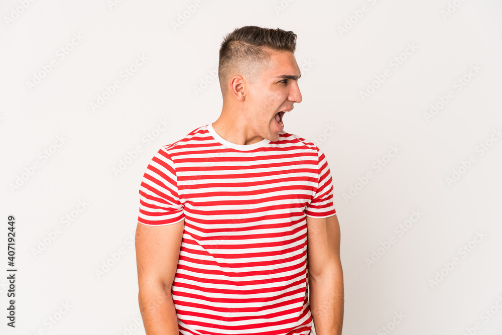 Young caucasian handsome man isolated shouting very angry, rage concept, frustrated. Young caucasian handsome man isolated shouting very angry, rage concept, frustrated.