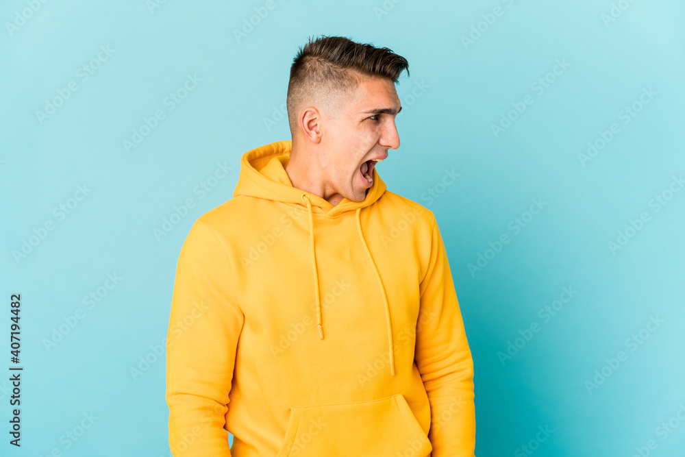 Young caucasian handsome man isolated shouting very angry, rage concept, frustrated. Young caucasian handsome man isolated shouting very angry, rage concept, frustrated.