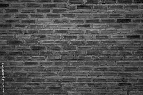 old brick wall background with black and white filter