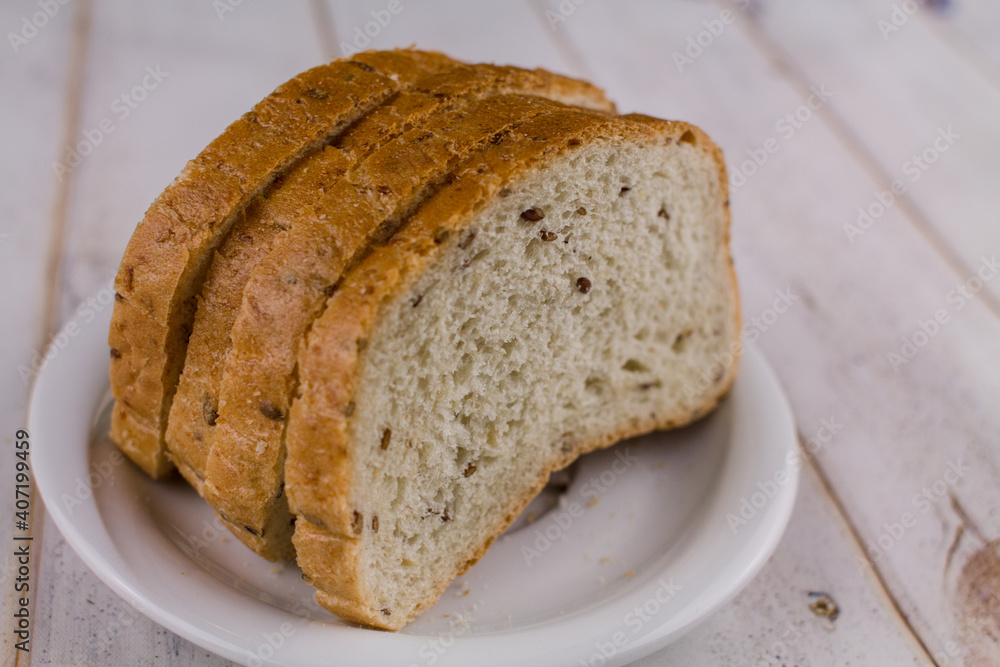 a sliced bread on a wooden table a sliced bread on a wooden table