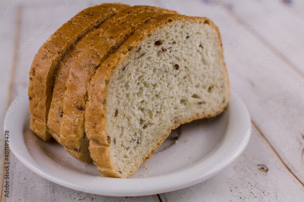 a sliced bread on a wooden table a sliced bread on a wooden table