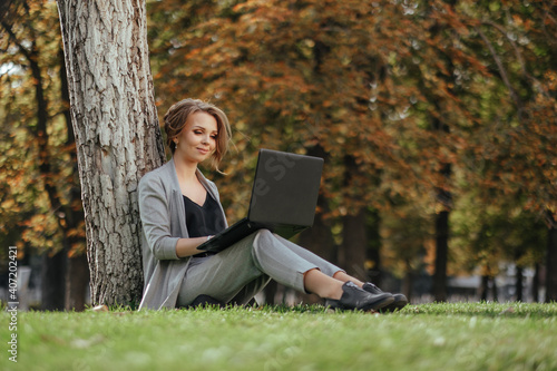 young happy business woman with laptop