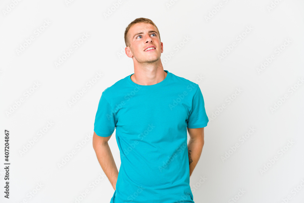 Obraz premium Young caucasian handsome man relaxed and happy laughing, neck stretched showing teeth.