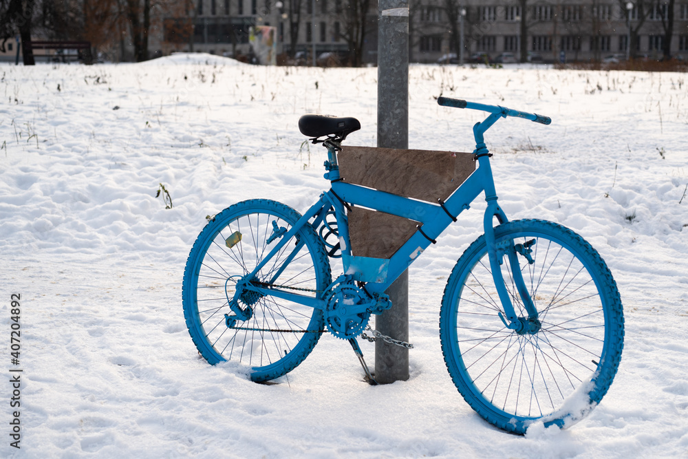 blue bicycle in snow