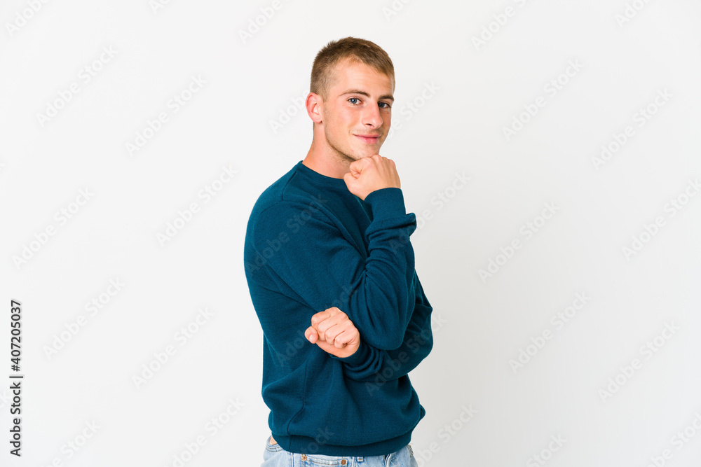 Young caucasian handsome man smiling happy and confident, touching chin with hand. Young caucasian handsome man smiling happy and confident, touching chin with hand.