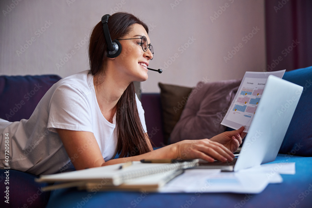 Jolly woman doing business in internet during conference Jolly woman doing business in internet during conference