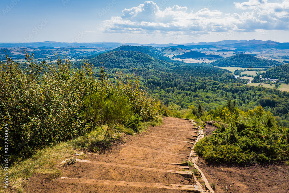 Naklejka premium View on the Chaine de Puys volcanoes from the top of the Puy de la Vache volcano in Auvergne, France