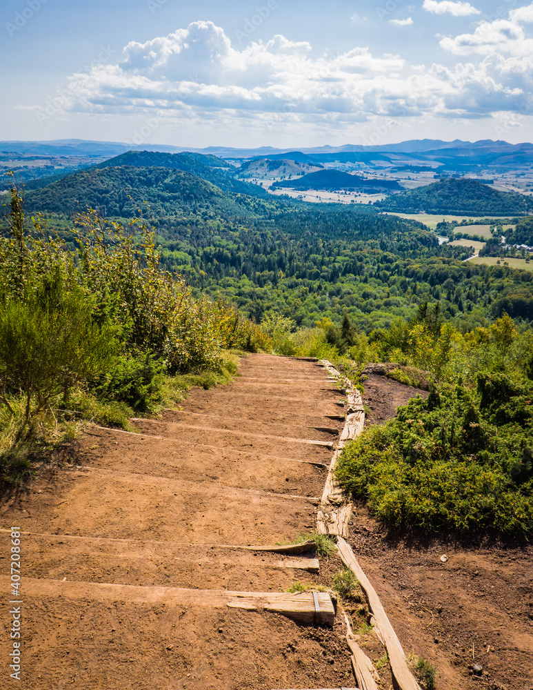 Fototapeta premium View on the Chaine de Puys volcanoes from the top of the Puy de la Vache volcano in Auvergne, France
