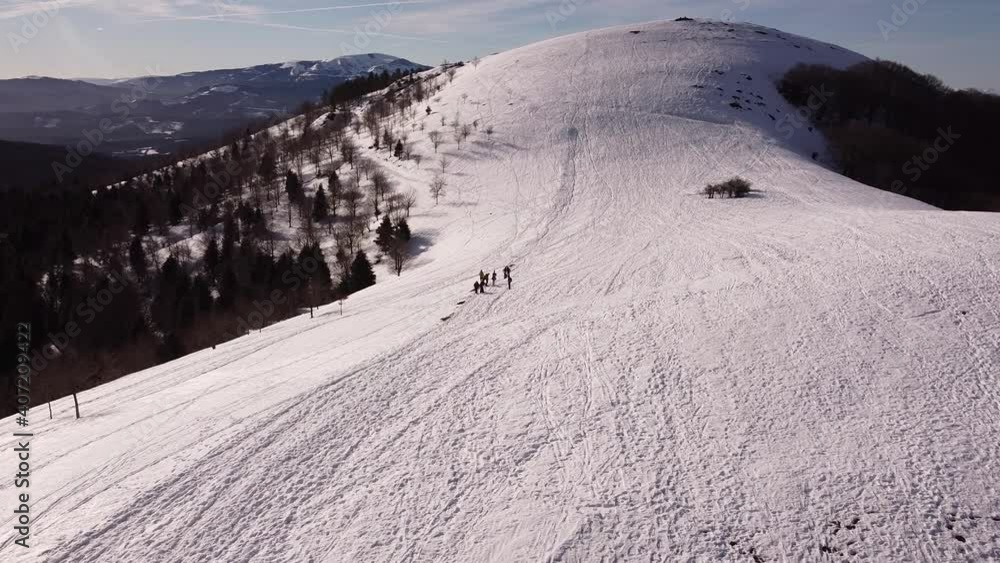 two alpinists going up the mountain in winter (aerial video) two alpinists going up the mountain in winter (aerial video)