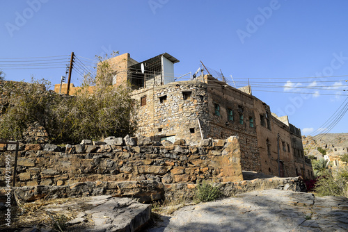 Abandoned houses made of stone in the ancient village of Misfat Al Abriyeen, Oman. photo