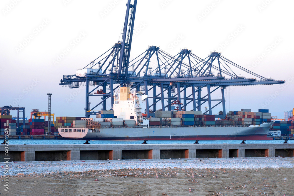 Container ships at industrial ports in the business of import, export, logistics and international transport.