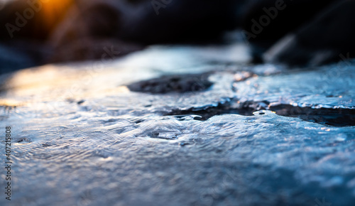 Closeup of ice on the rocky shore of norway