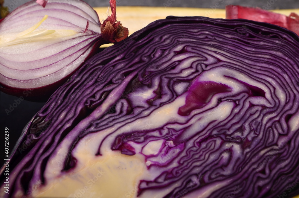 Obraz premium Still life of fresh purple vegetables on a gray background. Collection of fresh purple vegetables, Vegetable background