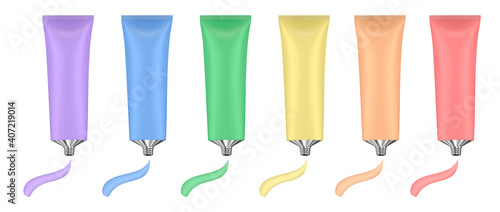 Rainbow palette of acrylic paint in metal tubes. Liquid watercolor. Oil paint or gouache. Paint smears. Tempera splash. Purple, blue, green, yellow, orange and red colors.