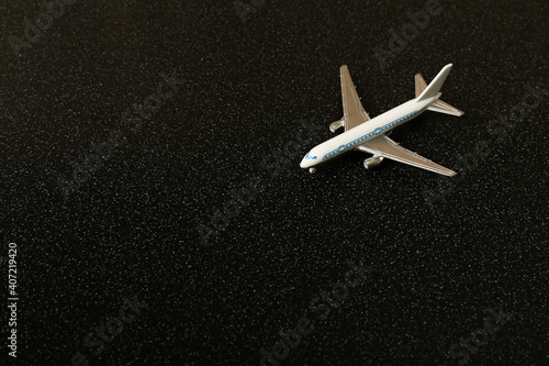 toy airplane on a black background close up with copy space