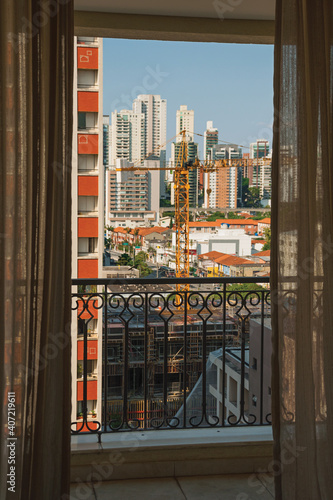 City skyline seen from a balcony in a building in Sa  o Paulo. The gigantic city  famous for its cultural and business vocation in Brazil.