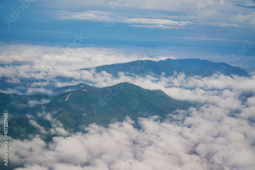 High mountain hill and cloud view from airplane window