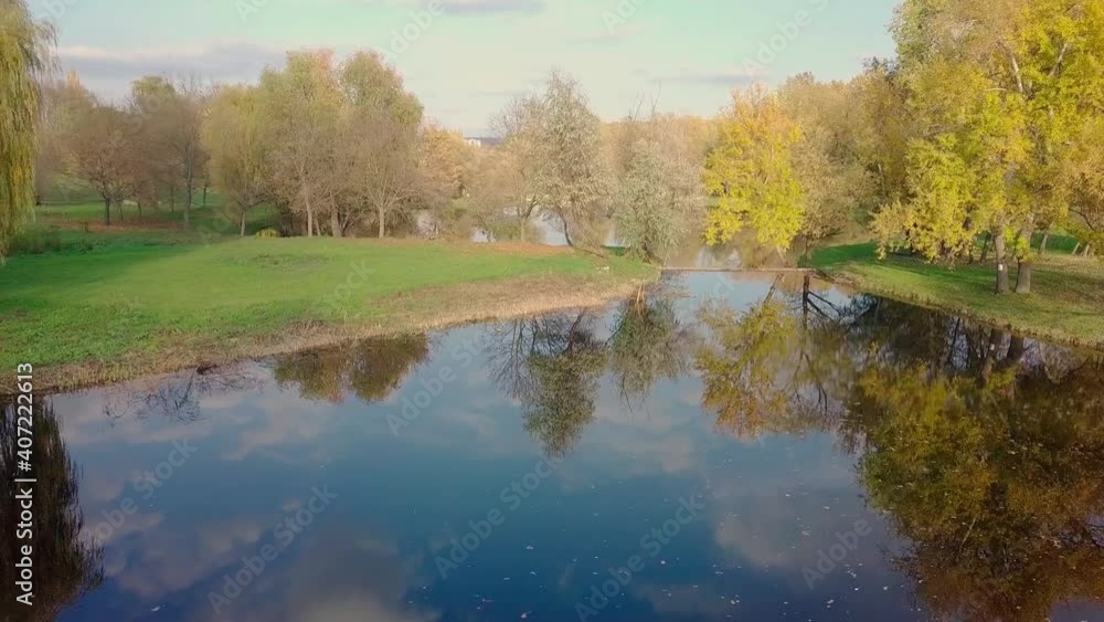 Aerial view with drone over a city, House located in the middle of the park. Beautifully protected lake. The city of Chisinau seen from above. Beautiful autumn landscape. Aerial view with drone over a city, House located in the middle of the park. Beautifully protected lake. The city of Chisinau seen from above. Beautiful autumn landscape.