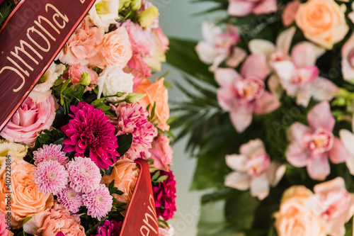 Close up of a funeral, flower wreath at a funeral ceremony 