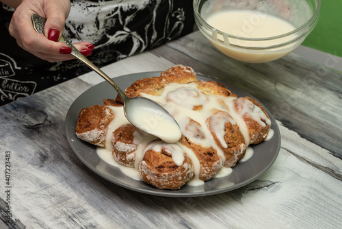 Beautiful fresh cinnamon rolls. The cooking process. Fresh fragrant pastries. Raw dough for buns.The process of making buns sinabon. photo