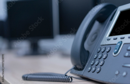 close up telephone landline at office background fo telecommunication technology and business concept	