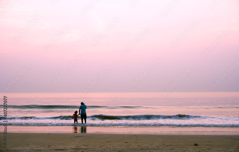 silhouette of people on the beach