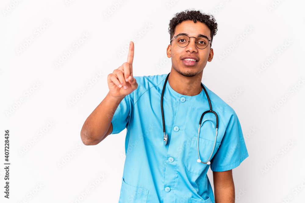 Young african american curly nurse man isolated showing number one with finger. Young african american curly nurse man isolated showing number one with finger.
