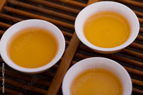 Three cups of tea on tray,close-up