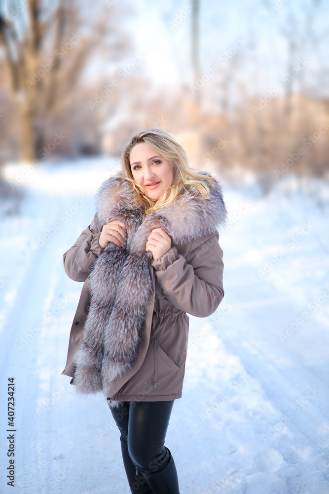 beautiful girl in a fur coat in a winter park beautiful girl in a fur coat in a winter park