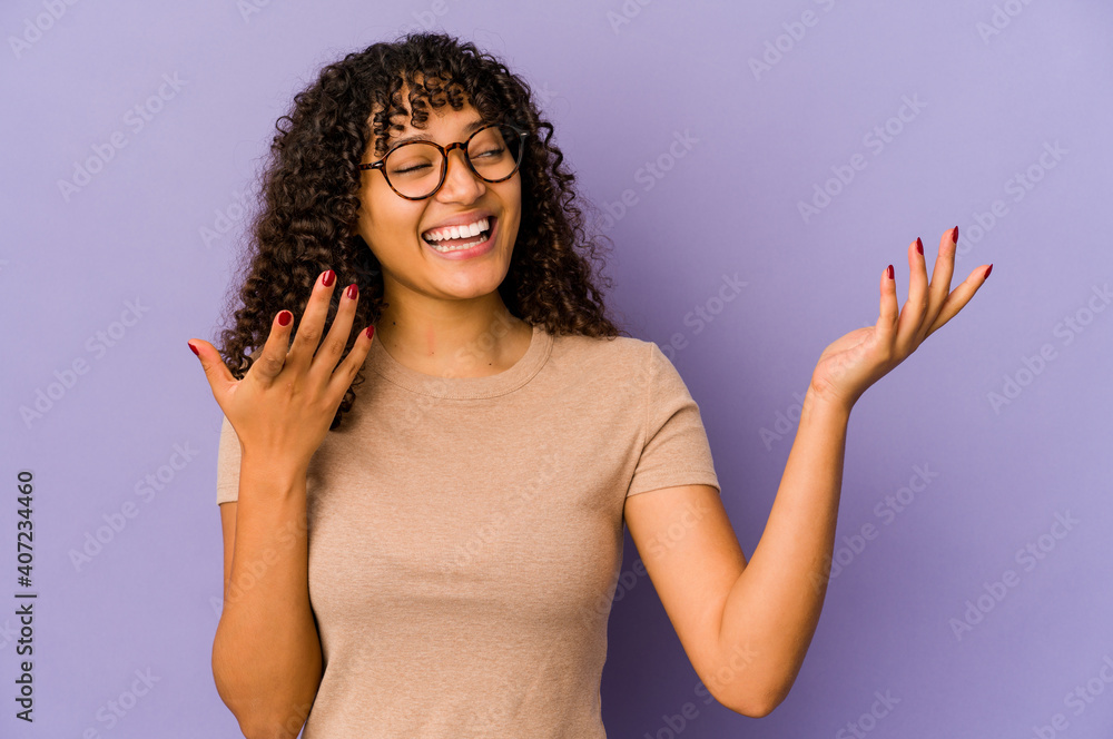 Young african american afro woman isolated joyful laughing a lot. Happiness concept. Young african american afro woman isolated joyful laughing a lot. Happiness concept.