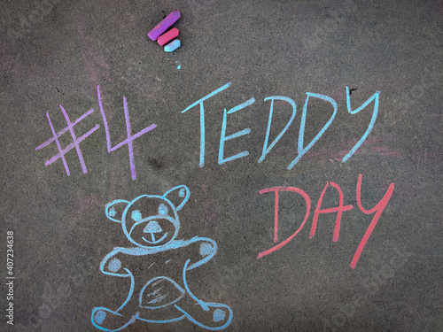 The inscription text on the grey board, #4 Teddy day with hand drawn teddy bear . Using color chalk pieces. Valentines week