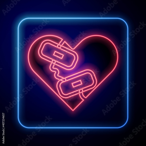 Glowing neon Healed broken heart or divorce icon isolated on blue background. Shattered and patched heart. Love symbol. Valentines day. Vector.