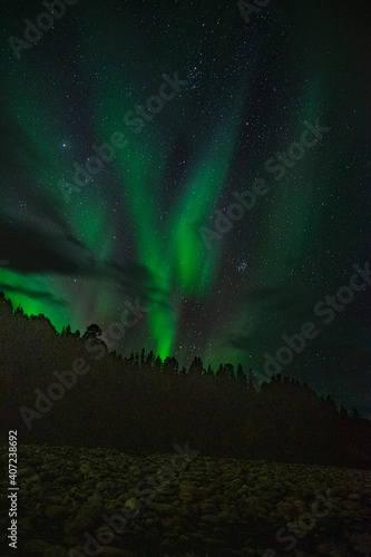 Northern lights in green and blue near Alta in Norway