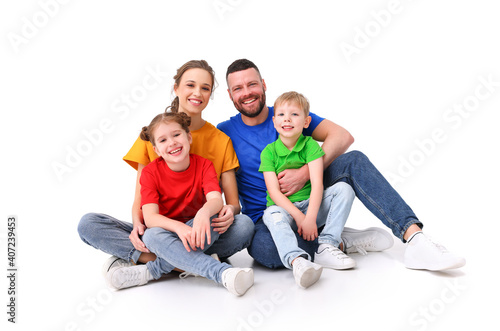 family portrait. parents and children in colorful T-shirts on an isolated white background
