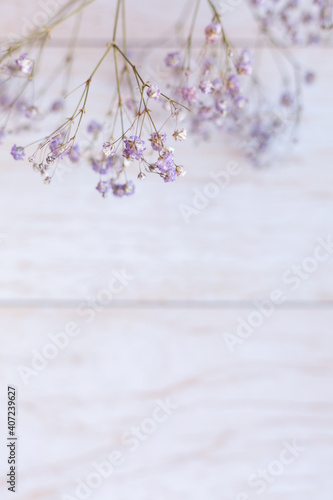 Dry flowers on wooden background, selective focus, spring mood