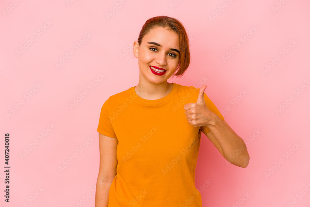 Young arab mixed race woman smiling and raising thumb up Young arab mixed race woman smiling and raising thumb up