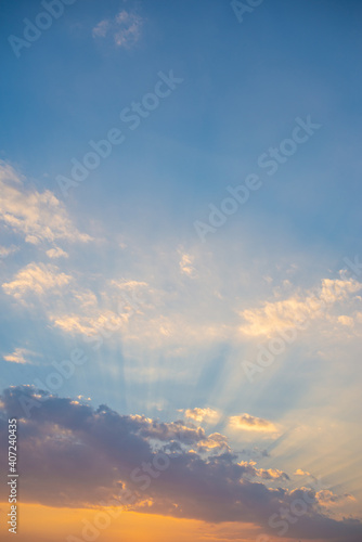 Evening sky and sun shining through the clouds © Sarawin