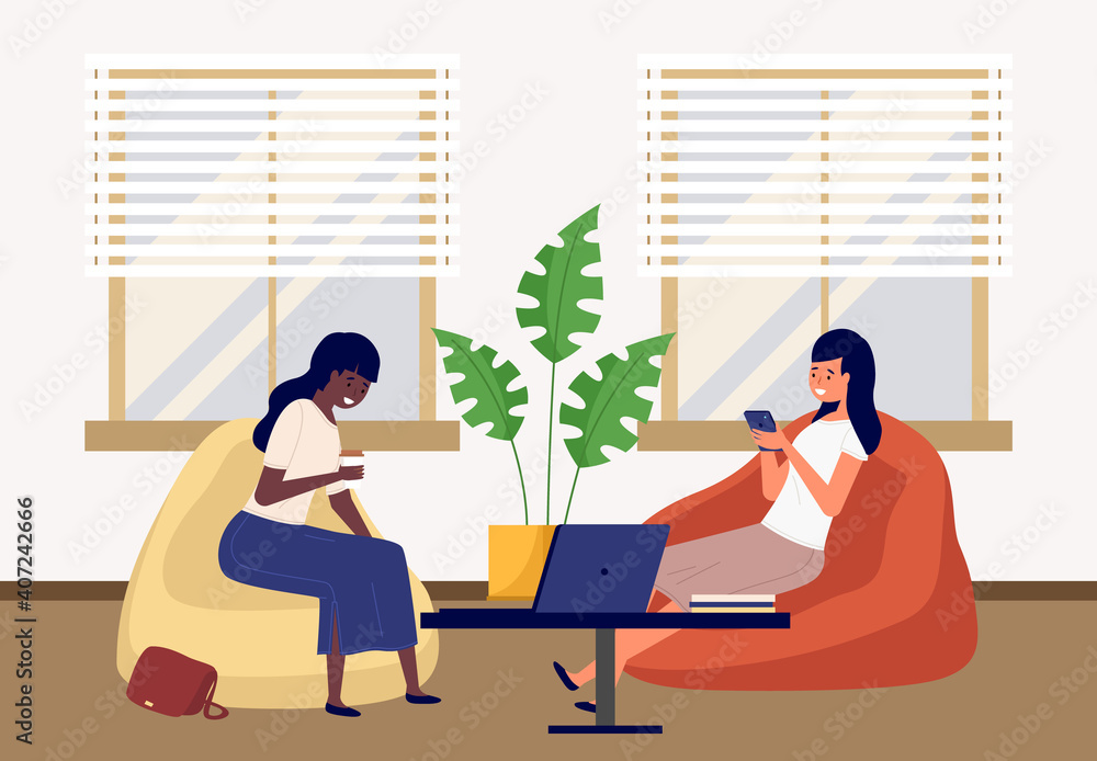 Fototapeta premium Two beautiful friends girls talking friendly while drinking coffee, vector illustration office space. Two employees, colleagues or business women sitting on bag chairs near the table with laptops