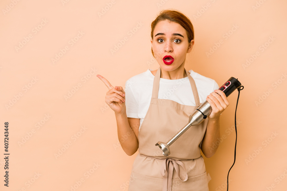 Young skinny arab cook woman pointing to the side Young skinny arab cook woman pointing to the side