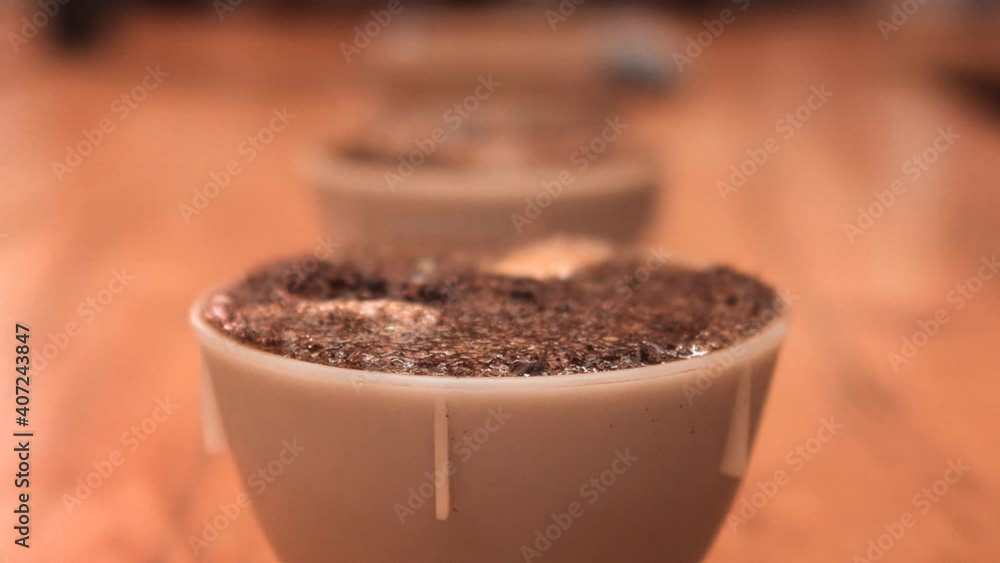 Ground roasted coffee with pouring water. Macro. Brewing an aromatic drink. Brown powder. Close up view. 4k Ground roasted coffee with pouring water. Macro. Brewing an aromatic drink. Brown powder. Close up view. 4k