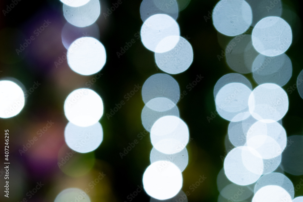 White bokeh at night with back black background. White bokeh at night with back black background.