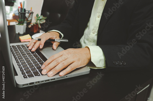 Businessman seacrh find information on Internet social media with computer laptop on desk. work for home. photo