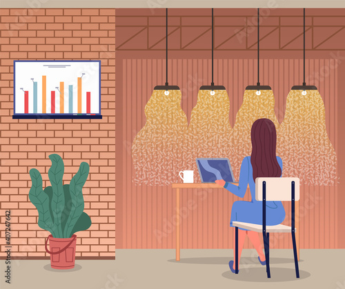 Woman working with laptop sitting in cafe. Businesslady has coffee break, cup with drink at table. Graphic at digital board at wall. Stylish interior design of cafe with lamps and pot with plant